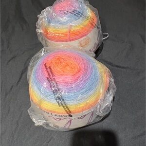 2 skeins Lion Brand Mandala Baby self-striping yarn. Acre Woods